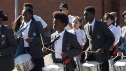 Exchanging Notes participants performing on the drums