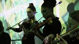 Young people playing violins