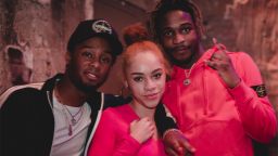 Three young people smiling at the camera