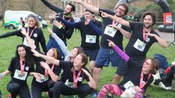 Group of runners pointing