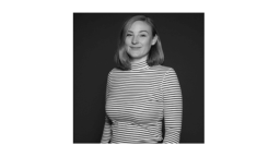 Black and white photo of woman in striped top