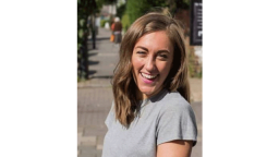 Woman smiling wearing grey t-shirt