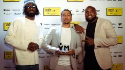 Award presenter Kojey Radical, award winner TL and Kenny Barbet, PRS for Music spokesperson