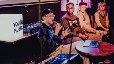 a group of young people on a panel