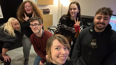 a group of people smile for a selfie