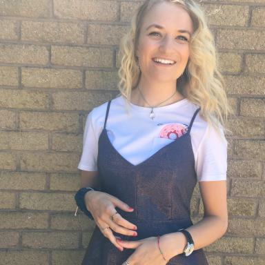 Young woman in white tshirt and black dress