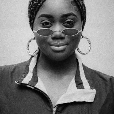 black and white image of woman wearing sunglasses 