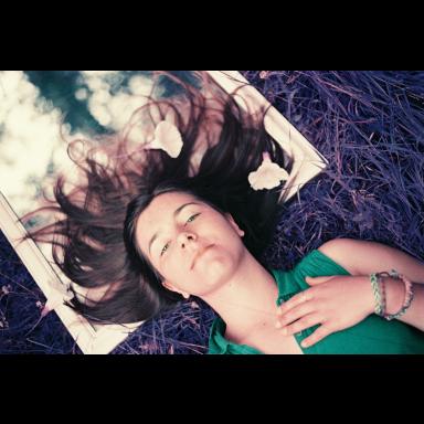 charity lying down with hair flowing around her