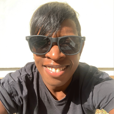 Woman wearing black t-shirt and sunglasses