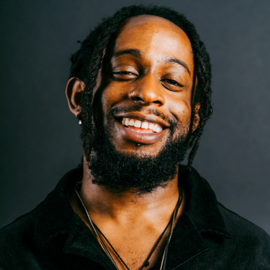 Man smiling wearing black shirt