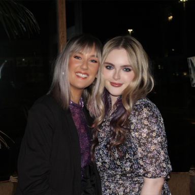 two women with blonde hair pose together and face the camera