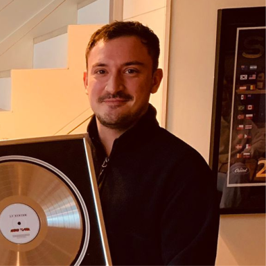 jay holds a framed record